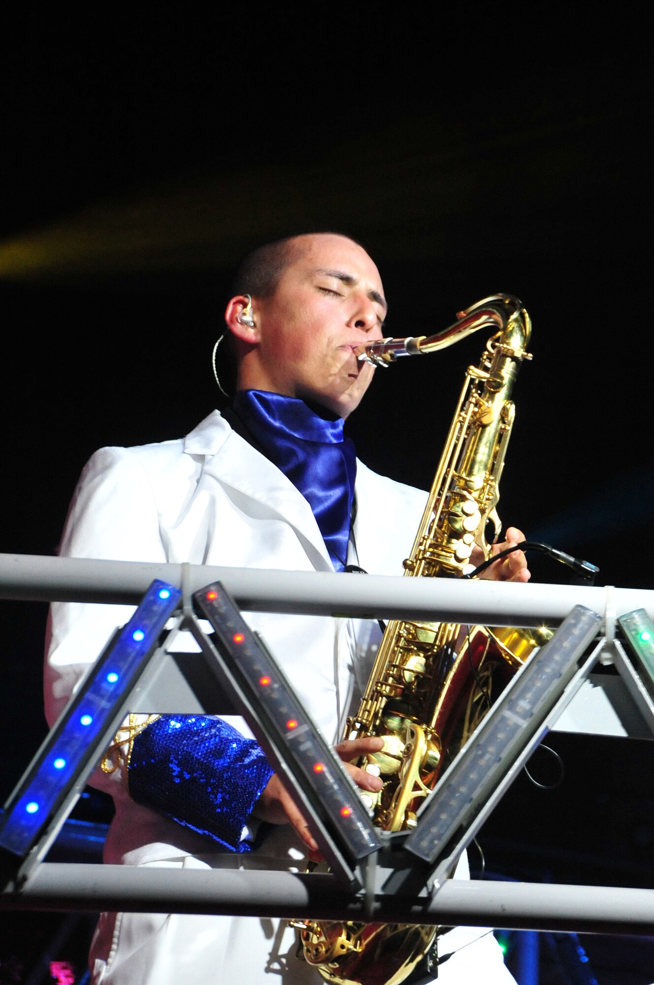 U.S. Air Force Airman 1st Class Ryan Ratkowski of the 341st Civil Engineer Squadron at Malmstrom Air Force Base, Mont., performs a saxophone solo at the Tops in Blue 2011 world tour at the Omaha Music Hall in Omaha, Neb., on July 6. The tour this year is themed "Rhythm Nation" and features songs from the past and present that helped shape our country's history. (U.S. Air Force Photo by D.P. Heard/Released)