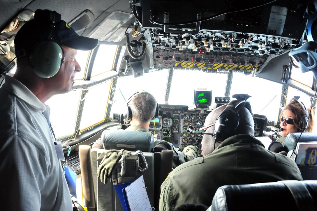SOMEWHERE OVER NORTHEAST OHIO -- The civilian employer of a Traditional Reservist assigned to the Air Force Reserve's 910th Airlift Wing talks with the flight crew of a 910th C-130H2 Hercules cargo aircraft during an orientation flight as part of annual Employer Awareness Day, July 10, 2011. The goal of the event is to increase the awareness of civilian employers to importance of the role Air Force Reservists have in the U.S. military. The 910th is based at based at Youngstown Air Reserve Station, Ohio. U.S. Air Force photo by Tech. Sgt. James Brock