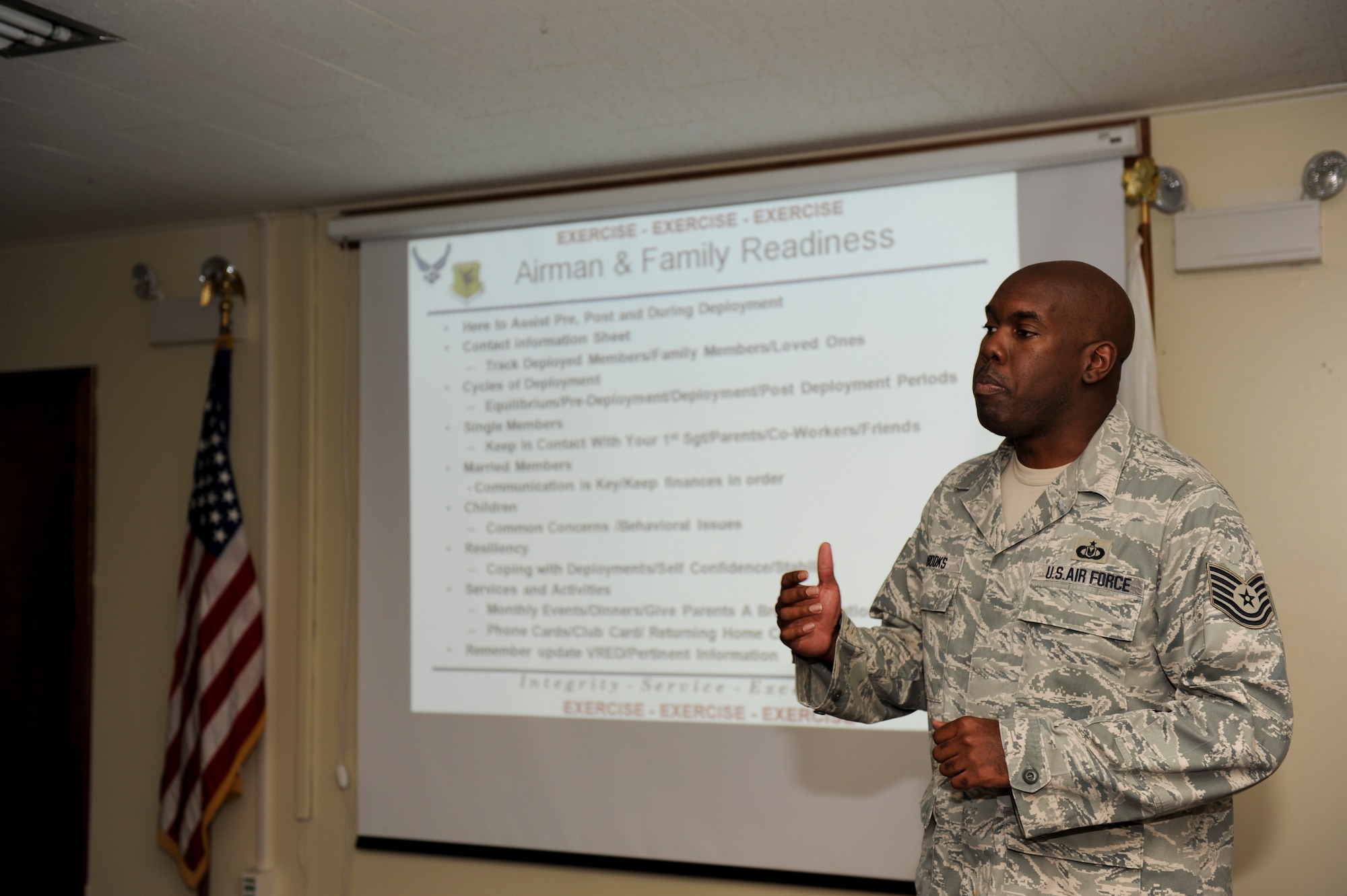 Tech. Sgt. Raynard Brooks, Airman and Family Readiness Center readiness NCO, briefs Airmen on what the A&FRC is capable of doing in times of deployment and how they benefit the Airmen’s lives July 11 during the Local Operation Readiness Exercise at Kadena Air Base, Japan. LOREs prepare Airmen for real-world contingencies by giving them an opportunity to practice important operational readiness skills. (U.S. Air Force photo/ Airman 1st Class Brooke P. Beers)