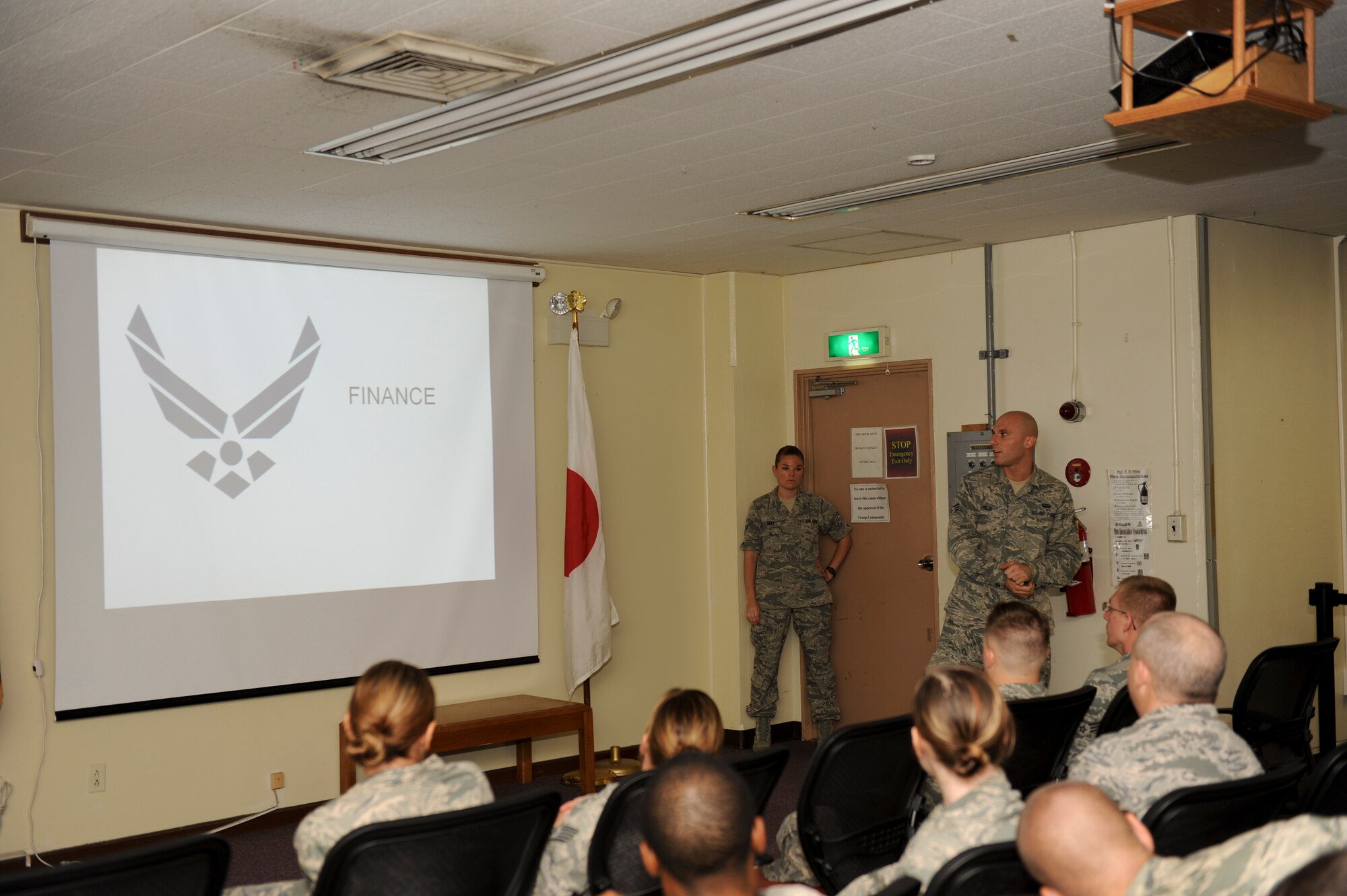 Senior Airman Eric Viola, 18th Wing Comptroller Squadron finance technician, briefs Airmen on finance during the Local Operation Readiness Exercise July 11 at Kadena Air Base, Japan. The exercise tested Team Kadena members’ capabilities during a simulated contingency, preparing them for future operations. (U.S. Air Force photo/ Airman 1st Class Brooke P. Beers)