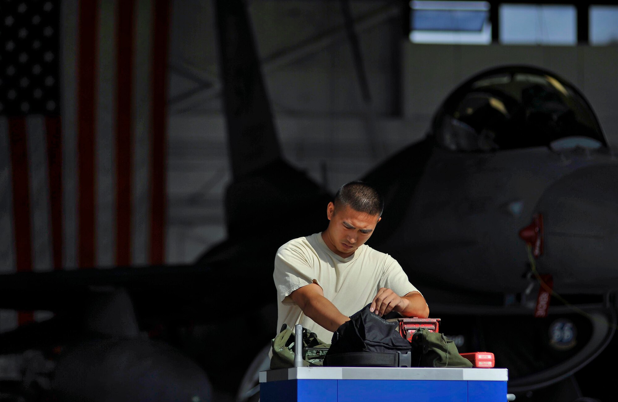 SHAW AIR FORCE BASE, S.C. -- Senior Airman Gerry Escalona, 55th Aircraft Maintenance Unit weapons load member, prepares his team?s tool box before competing in a weapons load competition here July 8, 2011. The 20th Fighter Wing weapons standardization unit held their quarterly weapons load crew of the quarter competition. The competition brings together weapons load crew members from all three fighter squadrons at Shaw to compete against each other to show who is the best. (U.S. Air Force photo by Senior Airman Kenny Holston)(Released)

