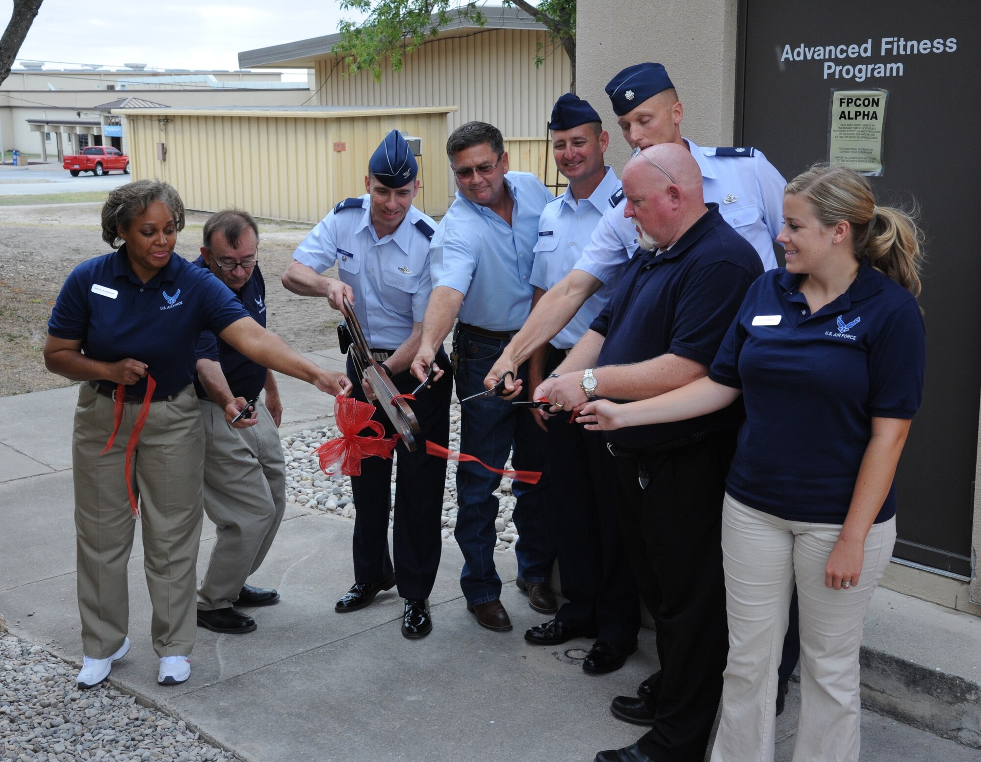LAUGHLIN AIR FORCE BASE, Texas – Members of the 47th Force Support Squadron and Laughlin’s leadership, including Col. Thomas Murphy, 47th Flying Training Wing vice commander, cut the ceremonial ribbon signifying the opening of Laughlin’s Advanced Fitness Program facility. The AFP will offer classes that incorporate different aspects of several workout programs designed to build strength and conditioning in their participants. (U.S. Air Force photo by Airman 1st Class Blake Mize)