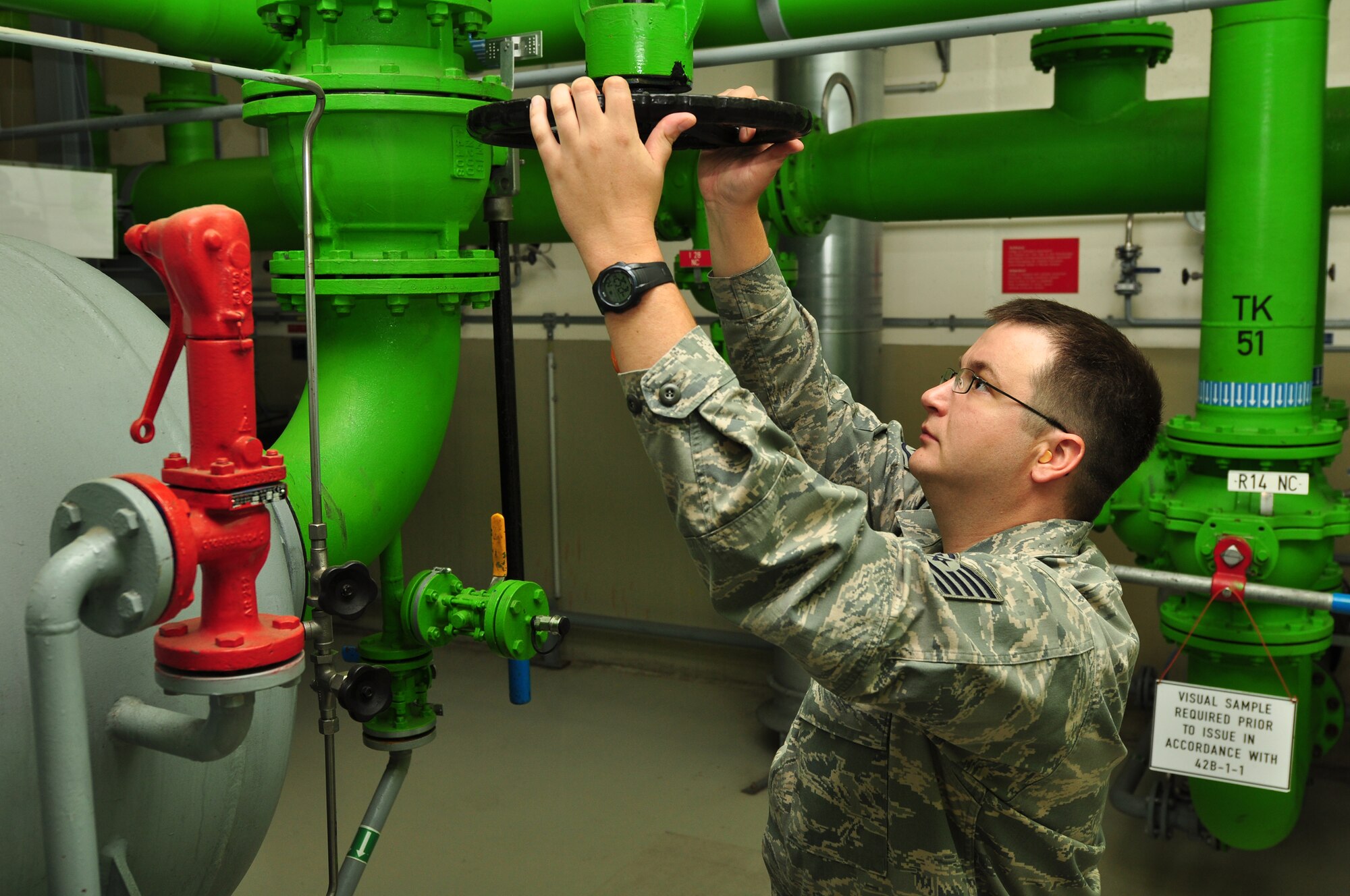 WRIGHT-PATTERSON AIR FORCE BASE, Ohio - Tech. Sgt. Mark Reel, 445th Logistics Readiness Squadron, adjusts a valve for fuel flow to underground hydrants at Ramstein Air Base, Germany, June 14. Sergeant Reel and 64 other 445th LRS Airmen spent their annual tour at Ramstein Air Base, Germany, June 11-25.  (U.S. Air Force photo/Senior Airman Mikhail Berlin)