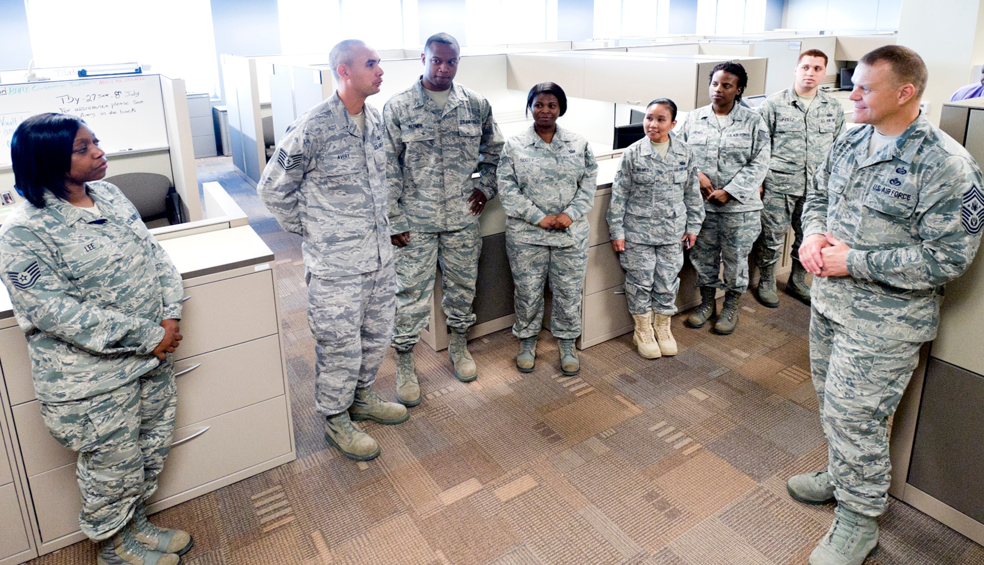 Chief Master Sergeant of the Air Force James A. Roy spends time with a group of AFOSI support staff members during his tour of the new OSI headquarters at Quantico, Va.