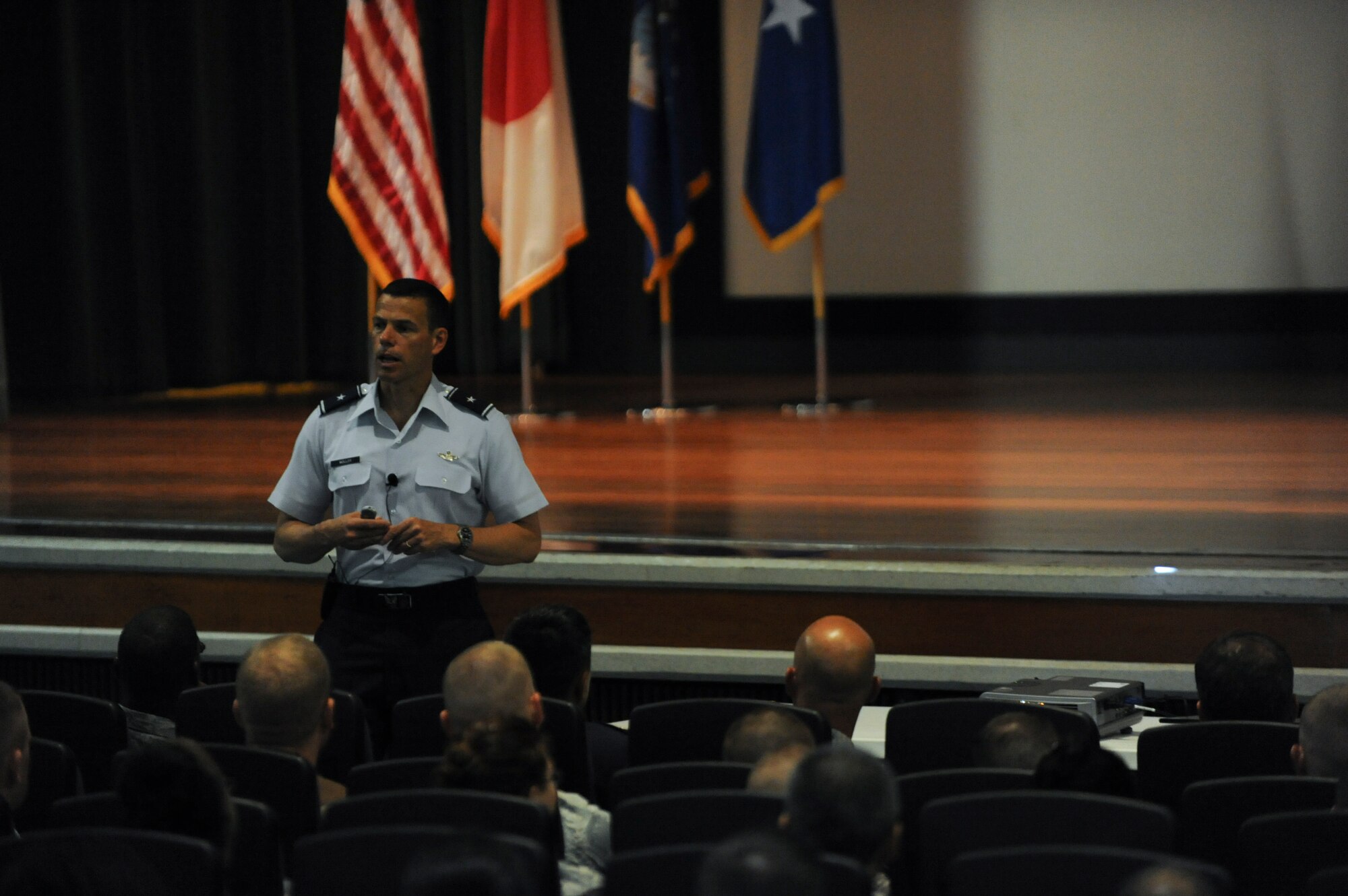 Brig. Gen. Matt Molloy, 18th Wing commander, talks to Airmen from both the 18th Wing Staff Agencies and the 18th Medical Group during a commander’s call July 8. Mission first, people always are the foundations Molloy hopes the Airmen will uphold not only during their time here but throughout their Air Force careers. (U.S. Air Force photo/ Airman 1st Class Brooke P. Beers)