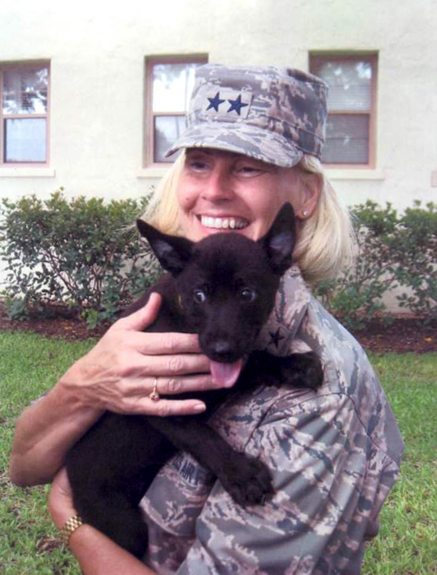 Maj. Gen. Mary Kay Hertog holds a Security Forces military working dog puppy.  (Courtesy photo)