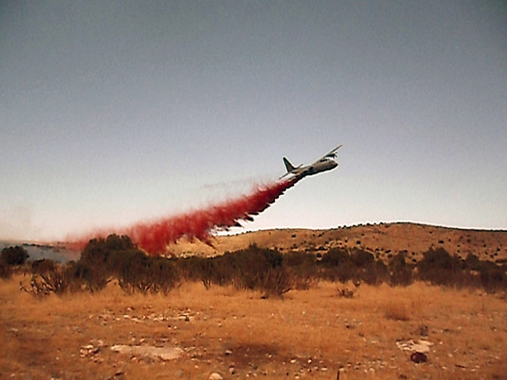 A 302nd Air Expeditionary Group MAFFS-equipped C-130 fire retardant, building a fire containment line over the Donaldson Fire in the Sacramento Mountains in New Mexico. (U.S. Forest Service photo/Jennifer Myslivy)