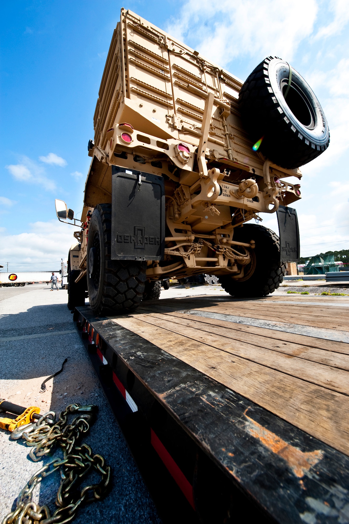 An Air Force Mine Resistant Ambush Protected vehicle backs onto a trailer prior to being taking off the base.  The 45 people assigned to 96th Logistics Readiness Squadron's cargo movement unload and ship out an almost 15,000 pieces through commercial carriers each year.  Their in-house capabilities allow them to create virtually any type of shipping material needed to store, secure and ship an item from Eglin.  (U.S. Air Force photo/Samuel King Jr.)    