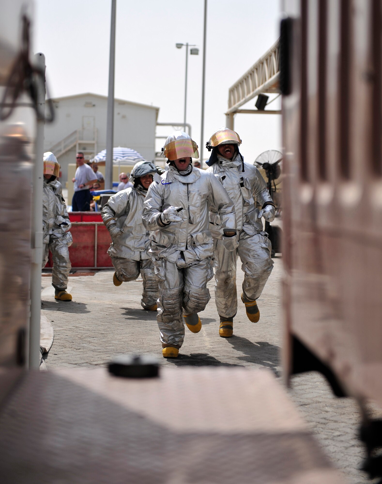 Airmen from the 380th Air Expeditionary Wing medical team participate in a fire muster competition July 10, 2011. Six teams competed in the event, which has become a tradition during each deployment rotation at the 380th AEW. (U.S. Air Force photo by Staff Sgt. Patrick Mitchell)