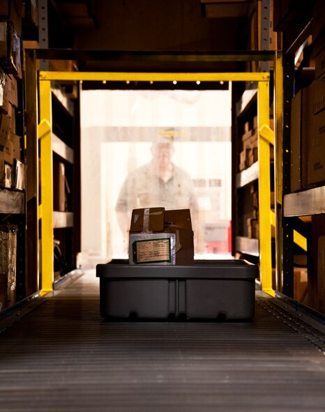 A newly packaged and labeled box is sent out on the conveyor belt to its next station within the 96th Logistics Readiness Squadron’s cargo movement section before being shipped out.  The 45 personnel of cargo movement unload and ship out an almost 15,000 pieces through commercial carriers each year.  Their in-house capabilities allow them to create virtually any type of shipping material need to store, secure and ship an item from Eglin.  (U.S. Air Force photo/Samuel King Jr.)