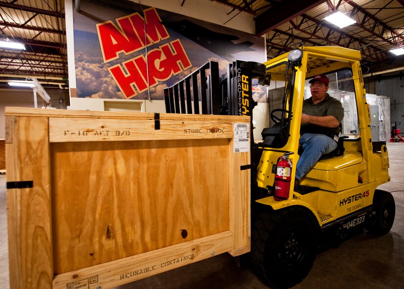 Art Ellington of 96th Logistics Readiness Squadron cargo movement, moves a wooden crate from the packing side to the shipping side of the warehouse.  The cargo movement section is responsible for packing and shipping equipment set to leave Eglin.   (U.S. Air Force photo/Samuel King Jr.)   