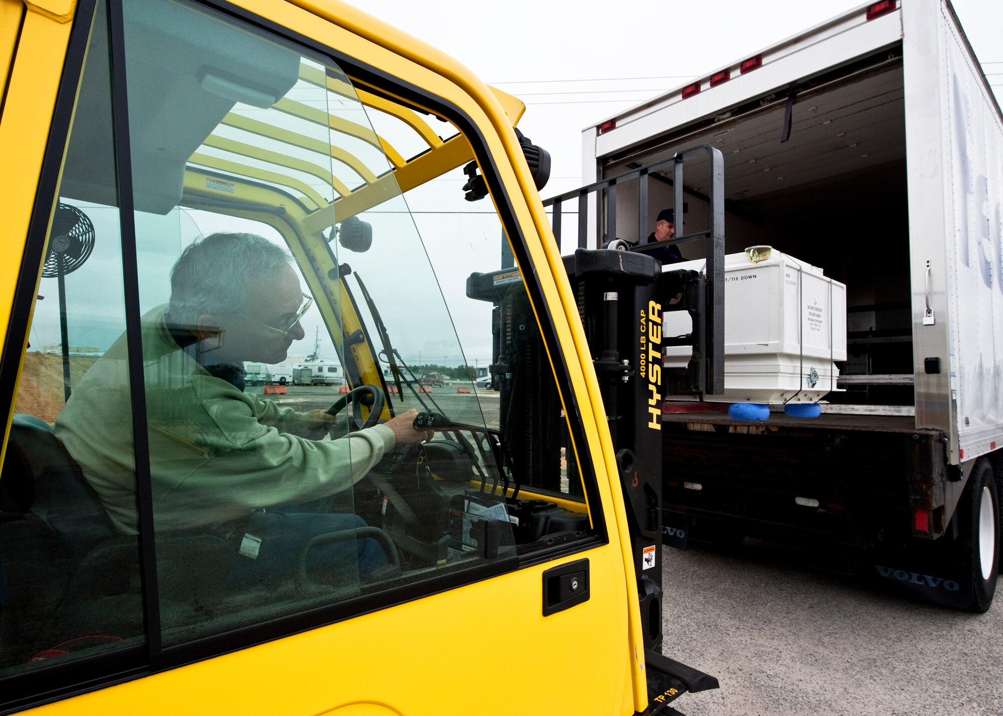 Richard Sarnosky of 96th Logistics Readiness Squadron cargo movement, loads a crate into a commercial carrier via forklift at Eglin Air Force Base, Fla. The 45 personnel of cargo movement unload and ship out an almost 15,000 pieces through commercial carriers each year. Their in-house capabilities allow them to create virtually any type of shipping material need to store, secure and ship an item from Eglin.  (U.S. Air Force photo/Samuel King Jr.)   