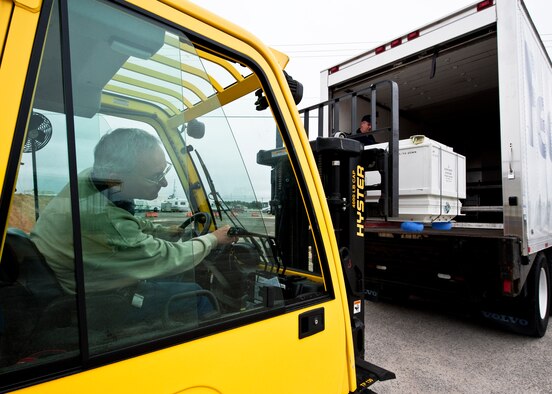 Richard Sarnosky of 96th Logistics Readiness Squadron cargo movement, loads a crate into a commercial carrier via forklift at Eglin Air Force Base, Fla. The 45 personnel of cargo movement unload and ship out an almost 15,000 pieces through commercial carriers each year. Their in-house capabilities allow them to create virtually any type of shipping material need to store, secure and ship an item from Eglin.  (U.S. Air Force photo/Samuel King Jr.)   