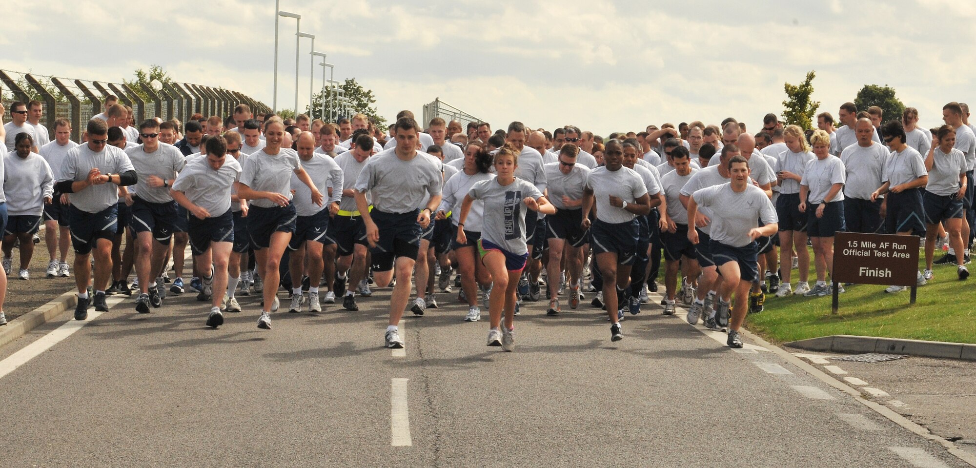 RAF MILDENHALL, England -- Airmen from Team Mildenhall start the monthly 5K fun run outside the Hardstand Fitness Center July 8, 2011.  The run gives Airmen an opportunity to enhance their physical fitness through healthy competition with their peers. (U.S. Air Force photo/Staff Sgt. Tabitha M. Lee)  