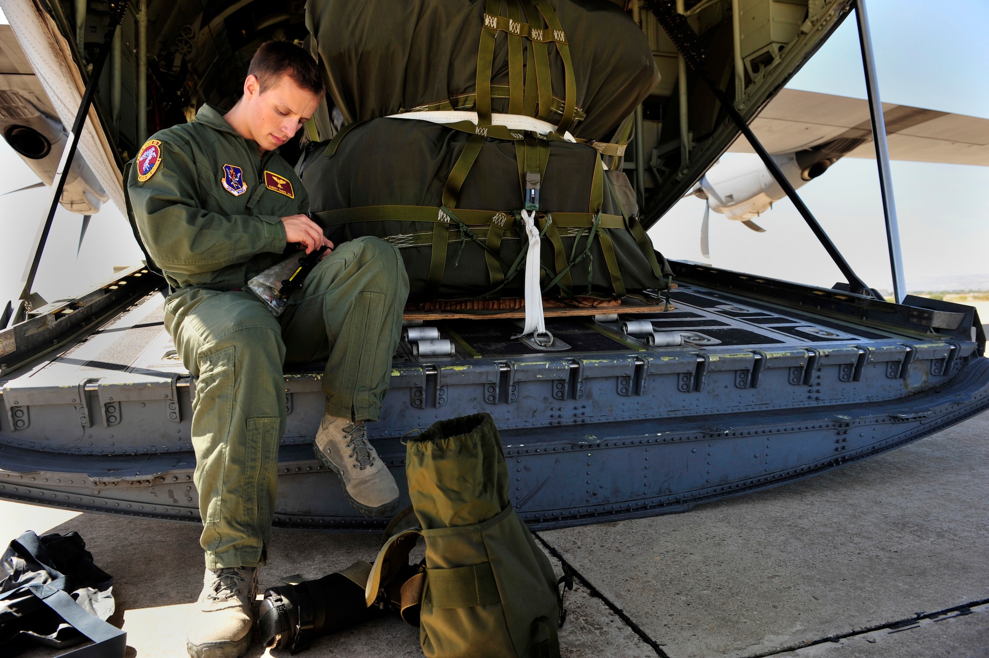 U.S. Senior Airman Robert Trubee, 48th Rescue Squadron para-jumper, checks his rescue kit prior to the space shuttle launch, July 8, 2011, Zaragoza Air Base, Spain.  As space shuttle Atlantis makes it's final launch into orbit, personnel from DoD, NASA, and the Spanish Air Force work together to prepare for a possible emergency landing at the Transoceanic Abort Landing Site, Zaragoza Air Base, Spain. This particular TAL is one of three primary landing sites within U.S. Air Forces Europe, and this is the 135th mission the U.S. military has supported.(U.S. Air Force photo by Tech. Sgt. Chenzira Mallory)