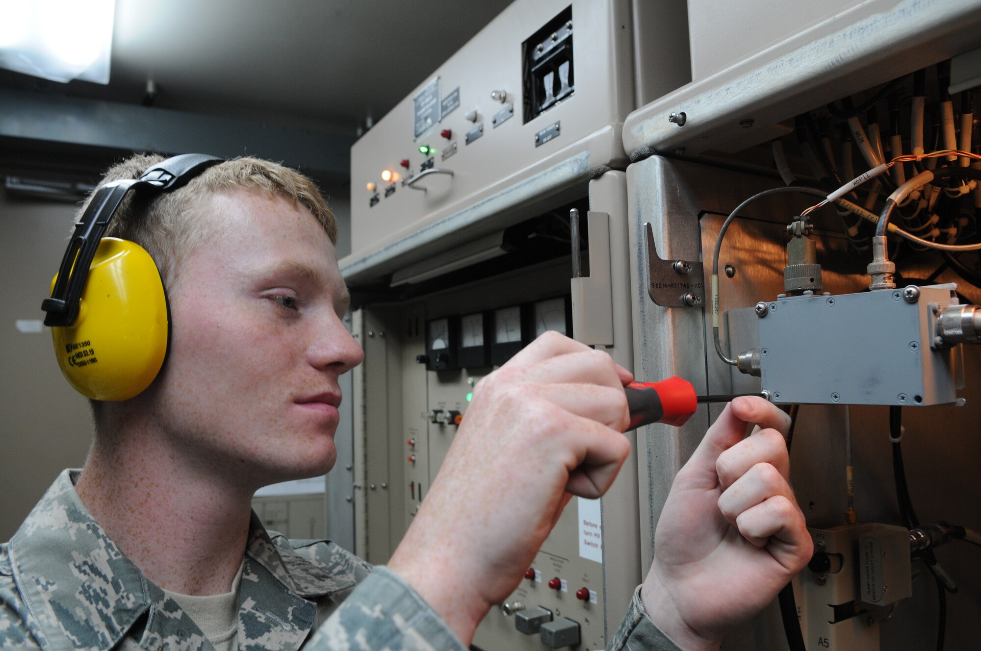 SPANGDAHLEM AIR BASE, Germany – Airman 1st Class Jacob Steele, 52nd Communications Squadron ground radar systems apprentice, inspects a radio frequency transmitter to ensure it complies with technical inspection standards here July 5. The 52nd CS’s ground radar systems Airmen are on the job all hours of the day to maintain and control the two radar systems that send information to the air-traffic control tower. (U.S. Air Force photo/Senior Airman Nick Wilson)
