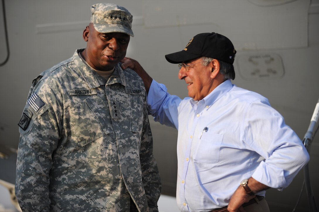 U.S. Defense Secretary Leon E. Panetta meets U.S. Army Gen. Lloyd J. Austin III, commander of U.S. Forces Iraq, as he arrives in Baghdad, July 10, 2011.