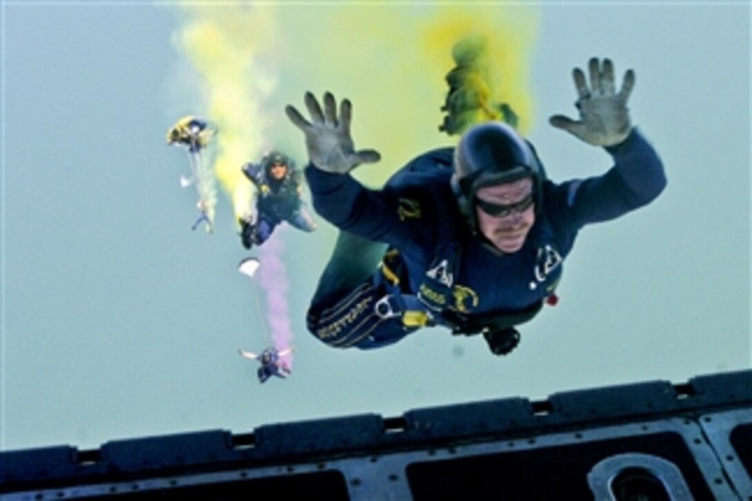 U.S. Navy Chief Petty Officer Larry Summerfield, assigned to the Navy parachute demonstration team, the Leap Frogs, jumps from a C-130 cargo aircraft during a training jump above Turner Field at Naval Amphibious Base Coronado in San Diego, on July 2, 2011.  The Leap Frogs perform aerial parachute demonstrations across the United States to support Naval Special Warfare and Navy Recruiting.  
