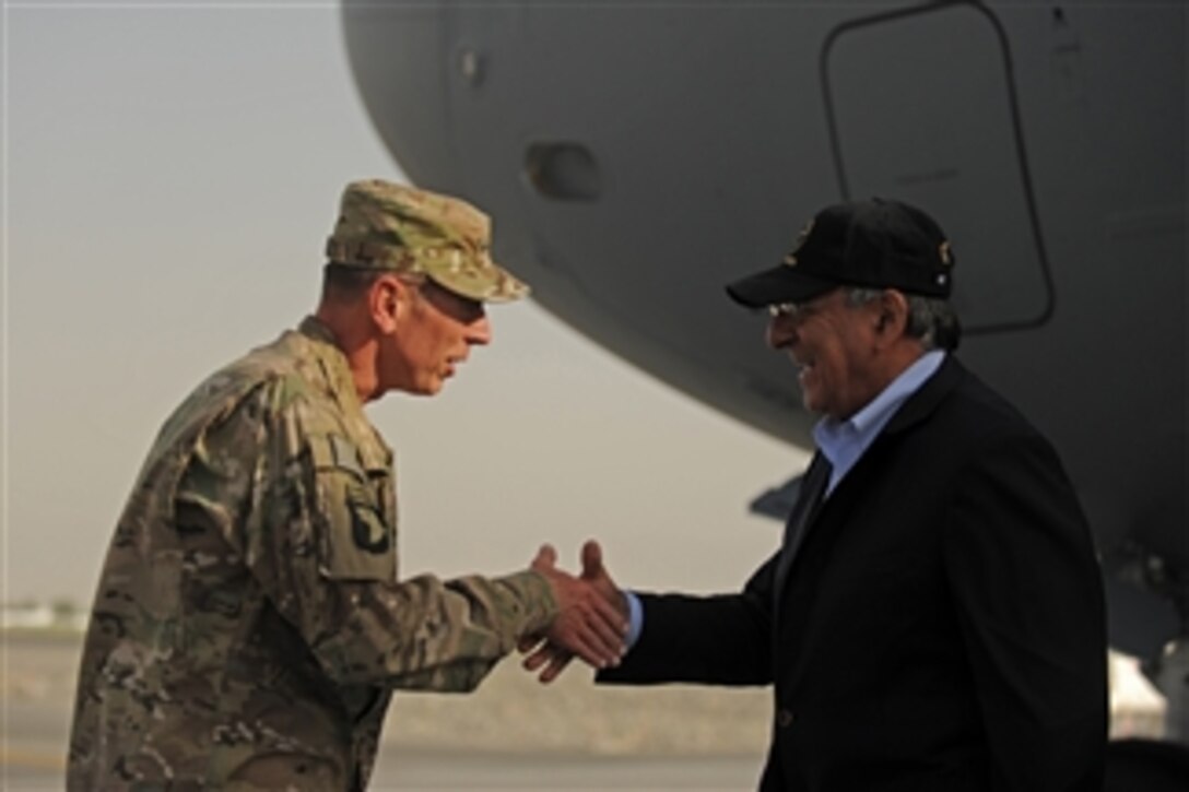 Commander of the NATO International Security Assistance Force Gen. David H. Petraeus greets Secretary of Defense Leon E. Panetta as he arrives at Camp Eggers, Kabul, Afghanistan, on July 9, 2011.  