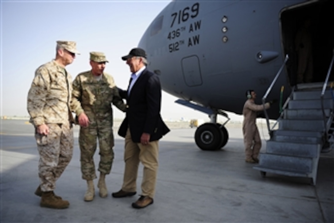 Future Commander of the NATO International Security Assistance Force Lt. Gen. John R. Allen and current Commander of the NATO International Security Assistance Force Gen. David H. Petraeus greet Secretary of Defense Leon E. Panetta as he arrives at Camp Eggers, Kabul, Afghanistan, on July 9, 2011.  