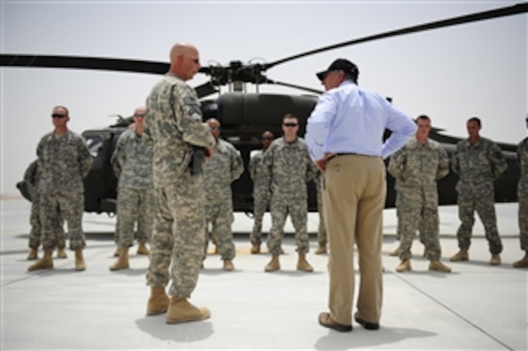 Maj. Patrick Zenk, 1-214 Aviation Regiment (Air Ambulance), briefs Secretary of Defense Leon E. Panetta at Camp Dwyer, Afghanistan, on July 10, 2011.  