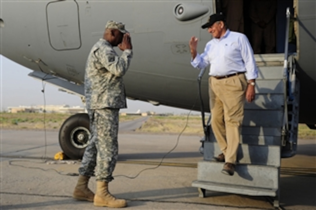 Secretary of Defense Leon E. Panetta is saluted by Commander of United States Forces-Iraq Gen. Lloyd J. Austin III as he arrives in Baghdad, Iraq, on July 10, 2011.  