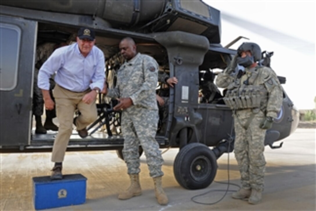 Secretary of Defense Leon E. Panetta steps off a UH-60 Blackhawk helicopter at Camp Victory, Iraq, on July 10, 2011.  