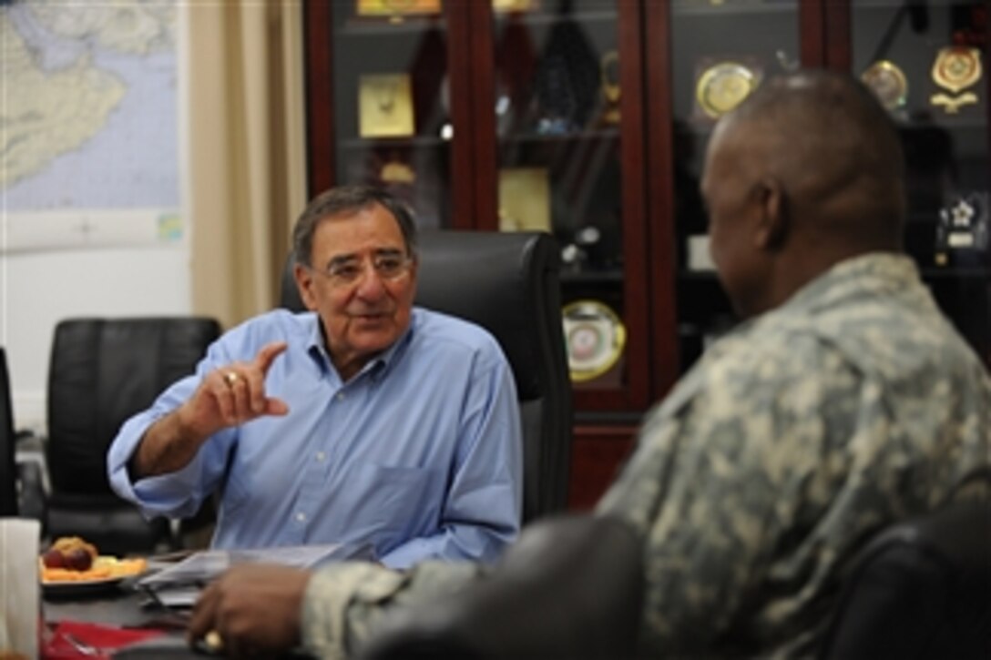 Secretary of Defense Leon E. Panetta meets with Commander of United States Forces-Iraq Gen. Lloyd J. Austin III at Camp Victory, Iraq, on July 11, 2011.  