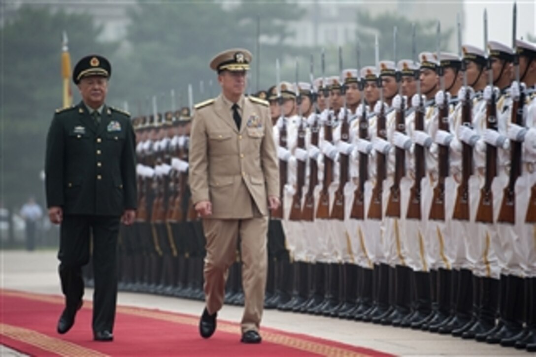 Chairman of the Joint Chiefs of Staff Adm. Mike Mullen is escorted by Chief of the Peoples Liberation Army's General Staff Gen. Chen Bingde during a ceremony welcoming Mullen to Beijing, China on July 11, 2011.  Mullen is on a three-day trip to the country meeting with counterparts and Chinese leaders.  