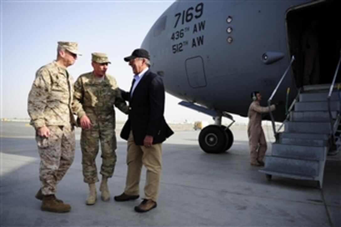 Future Commander of the NATO International Security Assistance Force Lt. Gen. John R. Allen and current Commander of the NATO International Security Assistance Force Gen. David H. Petraeus greet Secretary of Defense Leon E. Panetta as he arrives at Camp Eggers, Kabul, Afghanistan, on July 9, 2011.  