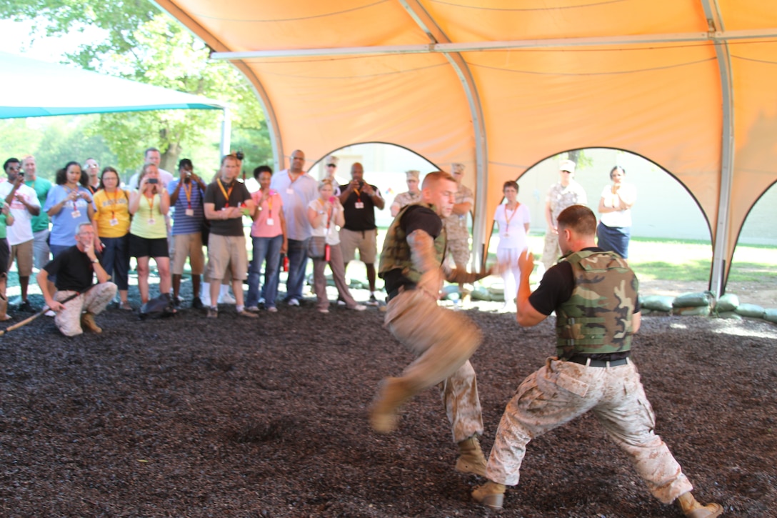 Black belt instructors with the Martial Arts Center of Excellence demonstrate the Marine Corps Martial Arts Program to educators with the Western Recruiting Region College and University Educators’ Workshop July 12. After seeing the demonstration, educators were taught a few MCMAP techniques.