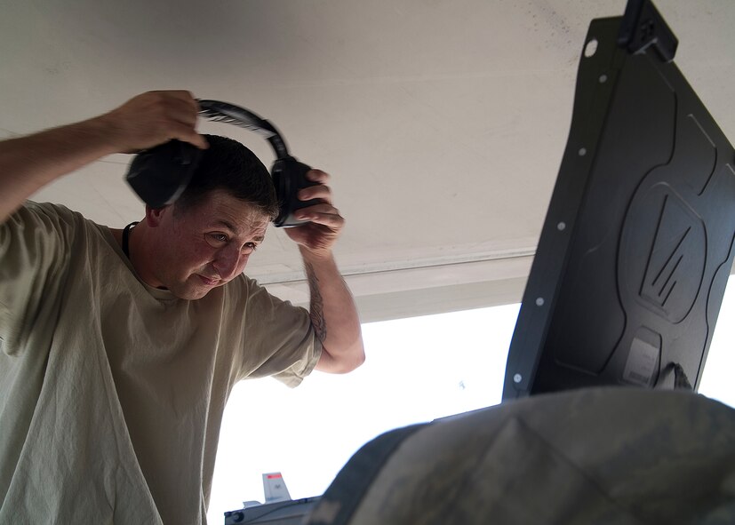 HOLLOMAN AIR FORCE BASE, N.M. -- Staff Sgt. Jessie Docking, 49th Aircraft Maintenance Squadron, dons his ear protection during a load crew competition July 8, 2011, outside of Hangar 301. The competition tests weapons load crew’s abilities to load multiple aircraft munitions with speed and precision. This particular competition marked the first time a German Air Force load crew participated with the 49th Maintenance Squadron’s crews. (U.S. Air Force photo by Senior Airman John D. Strong II/Released)