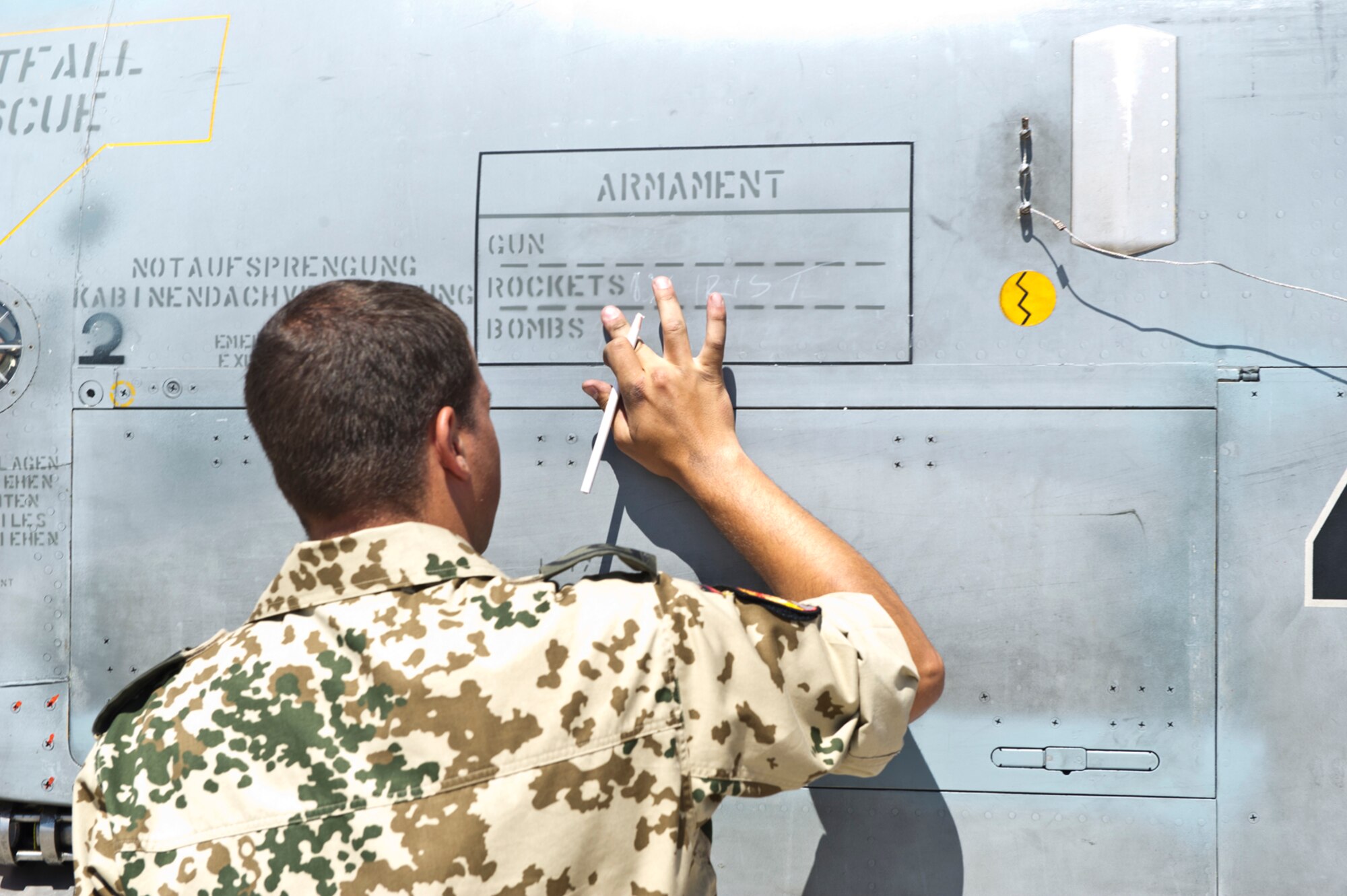 HOLLOMAN AIR FORCE BASE, N.M. -- German Air Force Tech. Sgt. Martin Wattler, crew chief, documents the Tornado’s armament July 8, 2011, during a quarterly load crew competition. This load crew competiton marked the first time the German Air Force has participated. The competitions are held to give weapons personnel the opportunity to display their warfighting skills and unveils the best weapons load crew for a particular quarter during the year. (U.S. Air Force photo by Airman 1st Class Joshua Turner/Released)
