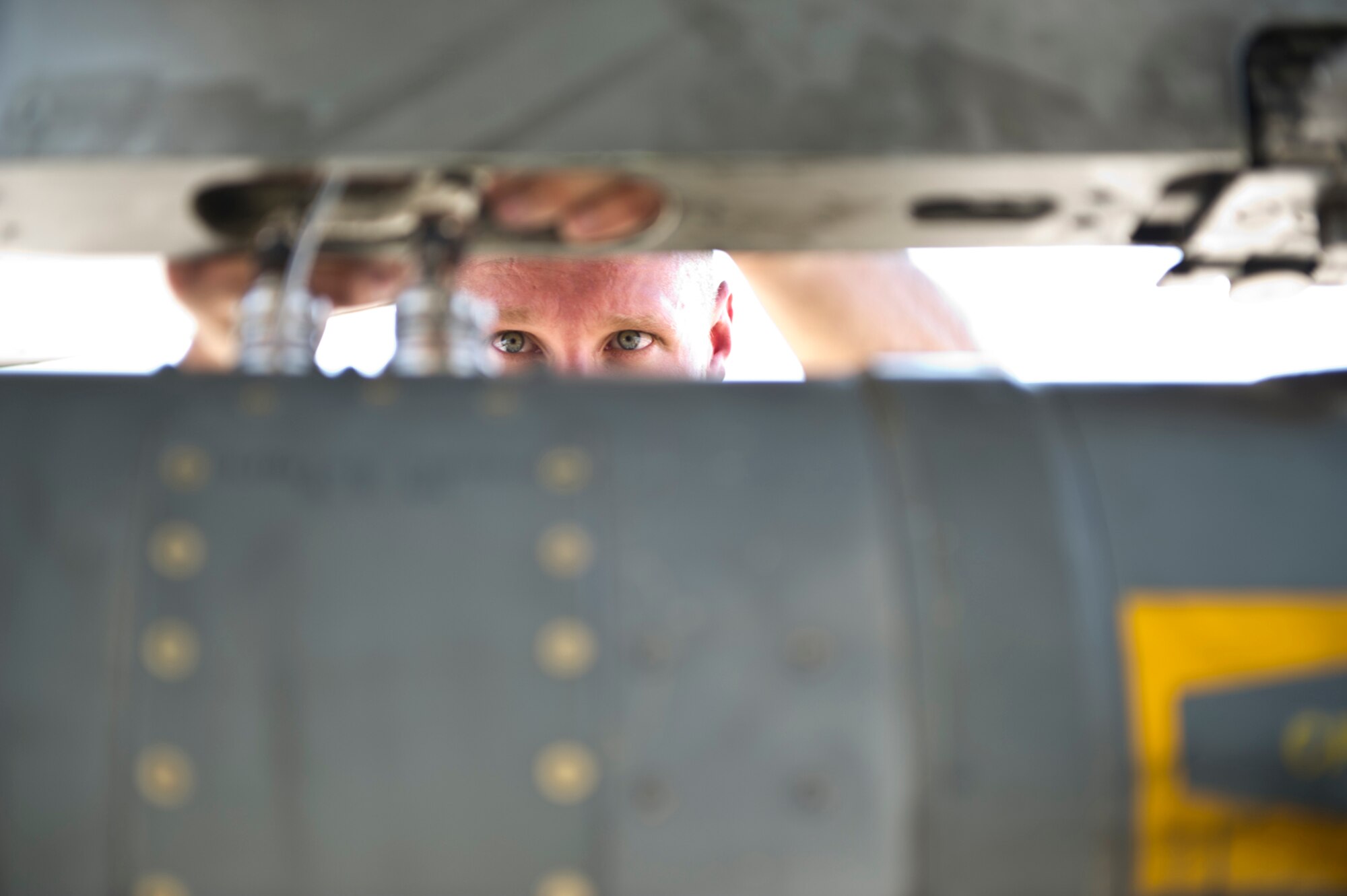 HOLLOMAN AIR FORCE BASE, N.M. -- German Air Force Tech. Sgt. Jens Feddersan, crew chief, connects a CIII radar jammer to a Tornado July 8, 2011, during a quarterly load crew competition. The competitions are held to give weapons personnel the opportunity to display their warfighting skills and unveils the best weapons load crew for a particular quarter during the year. The GAF crew chiefs were competing for the first time, loading a Tornado while the 49th Maintenance Group loaded an F-22 Raptor and a MQ-9 Reaper. (U.S. Air Force photo by Airman 1st Class Joshua Turner/Released)