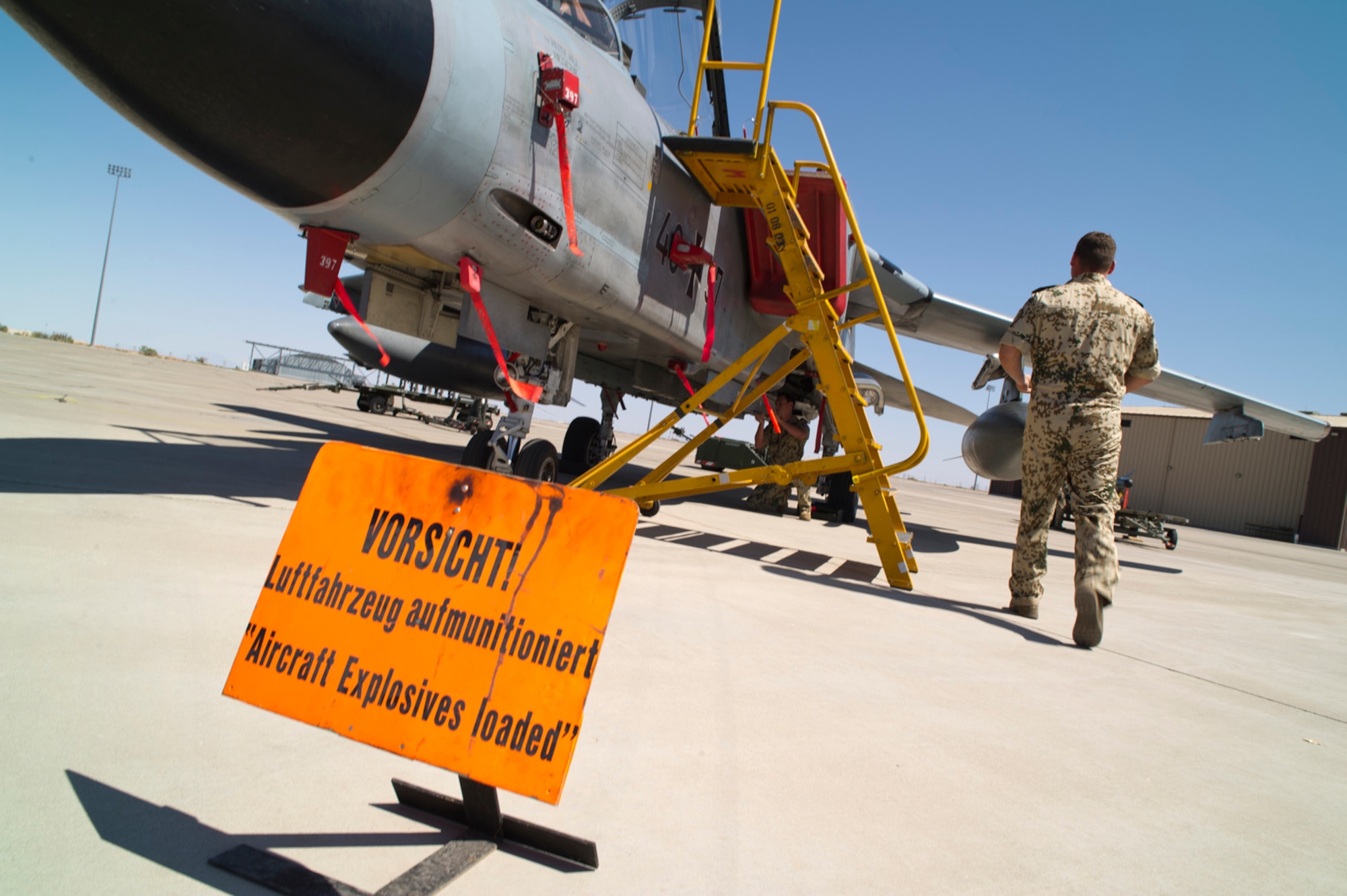 HOLLOMAN AIR FORCE BASE, N.M. -- German Air Force Tech. Sgt. Martin Wattler, crew chief, runs toward a Tornado, July 8, 2011, during a quarterly load crew competition. The GAF crew chiefs were competing for the first time loading a Tornado while the 49th Maintenance Group loaded an F-22 Raptor and a MQ-9 Reaper. The competitions are held to give weapons personnel the opportunity to display their warfighting skills and unveils the best weapons load crew for a particular quarter during the year.  (U.S. Air Force photo by Airman 1st Class Joshua Turner/Released) 