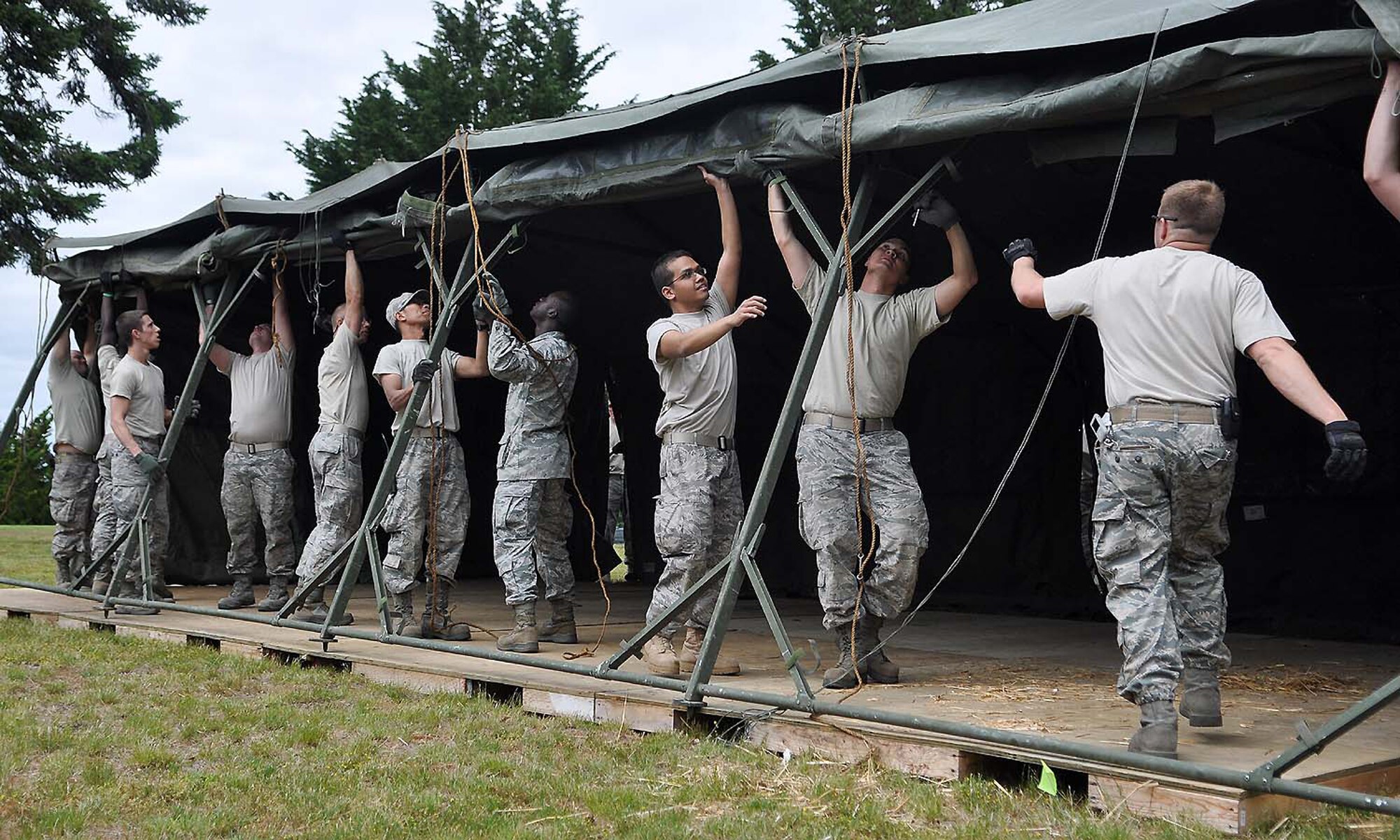 Airmen set up tents June 21, 2011, at Joint Base Lewis-McChord, Wash. (U.S. Air Force photo/Airman 1st Class Leah Young)