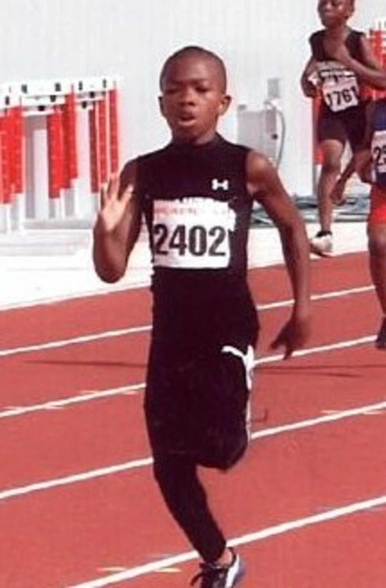 LAUGHLIN AIR FORCE BASE, Texas - - Vincent Terrell, son of Maj. Vincent Terrell, 47th Communication Squadron commander, and Machelle Terrell, 47th Flying Training Wing sexual assault response coordinator, runs in the 100-meter dash at the 2011 Amateur Athletic Union National Qualifier Meet in Converse, Texas. He will participate in the National Junior Olympics in New Orleans this August. (Contributed photo) 