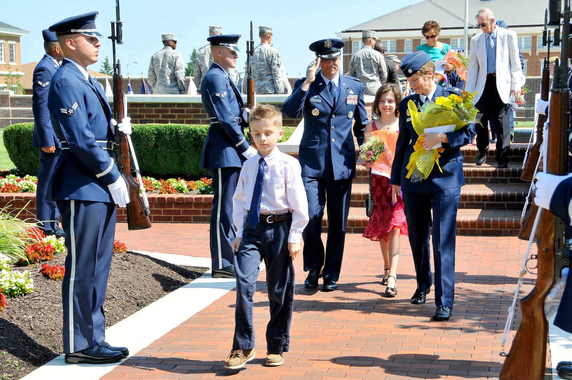 Lt. Col. Kenneth A. Marentette, U.S. Air Force Honor Guard commander and his family depart following the change of command ceremony on the ceremonial lawn, July 12, Joint Base Anacostia-Bolling, D.C. Marentette assumed command  from  Lt. Col. Raymond Powell  The ceremony was hosted by Col. Gina M. Humble, 11th Operations Group commander. (U.S. Air Force photo by Senior Airman Steele C. G. Britton)