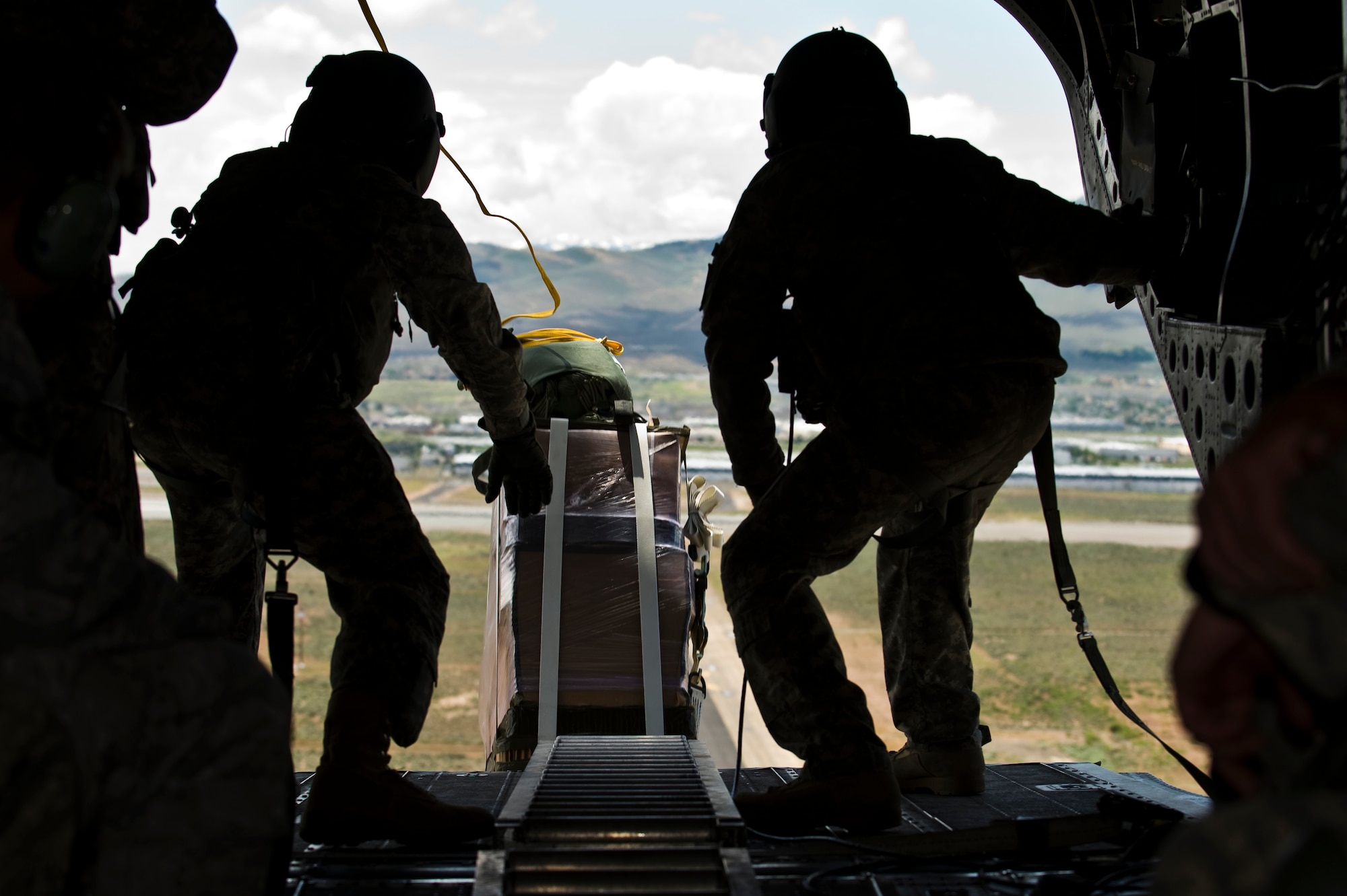 Members of the Nevada Army National Guard 1st Battalion, 189th Aviation Company release cargo from a CH-47 Chinook helicopter June 28, 2011, inside the Senator Harry Reid Readiness and Training Center in Stead, Nev. Members of the guard unit trained with U.S. Air Force 820th RED HORSE Squadron airborne flight members to improve their expertise in conducting air drops and sling-load operations. (U.S. Air Force photo by Senior Airman Brett Clashman/Released)
 
