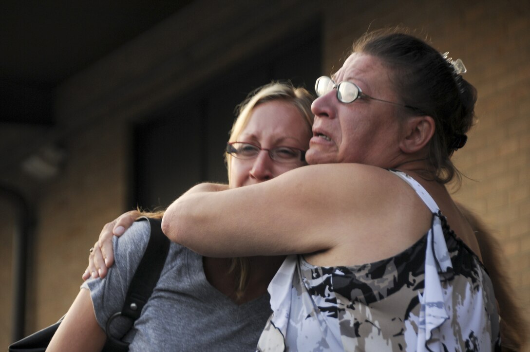 Family members of Airmen from the 108th Security Force Squadron, a New Jersey Air National Guard unit, bid farewell to their deploying Airmen. The 108th SFS Airmen departed from Joint Base McGuire-Dix-Lakehurst on July 12, 2011. Approximately 30 security forces members deployed to Southwest Asia in support of Operation New Dawn where they will be responsible for maintaining security at the air base. (U.S. Air Force photo/Airman Kellyann Novak)