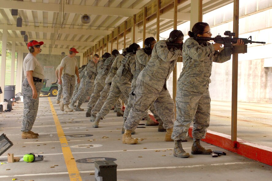 94th Security Forces Airmen shoot to qualify on the M-4 Carbine at Dobbins Air Reserve Base during the monthly Unit Training Assembly, July 9.  94th Security Forces Combat Arms Training and Maintenance instructors conduct the training with several hours of classroom and firing range instruction ending with a qualification course of fire.  (U.S. Air Force photo/ Brad Fallin)