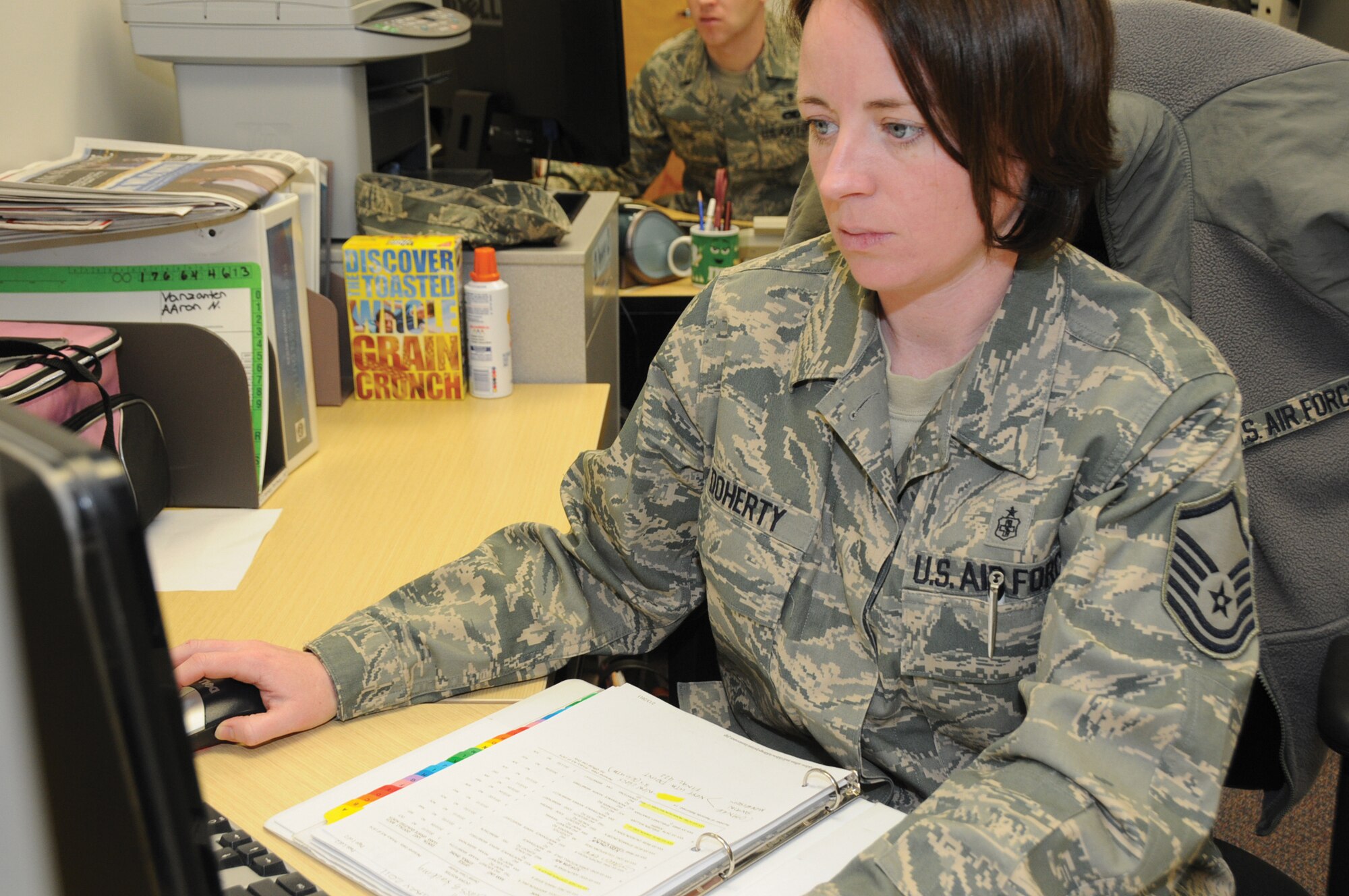 Master Sgt. Pamela Doherty, 442nd Medical Squadron Dental Flight, Works at the dental clinic reception desk. Dental is a vital component of deployment readiness, which will be necessary for the wing’s operational readiness inspection, August 2011. The 442nd Fighter Wing is an A-10 Thunderbolt II Air Force Reserve unit at Whiteman AFB, Mo.  (U.S. Air Force photo/ Senior Airman Tracy Brown)