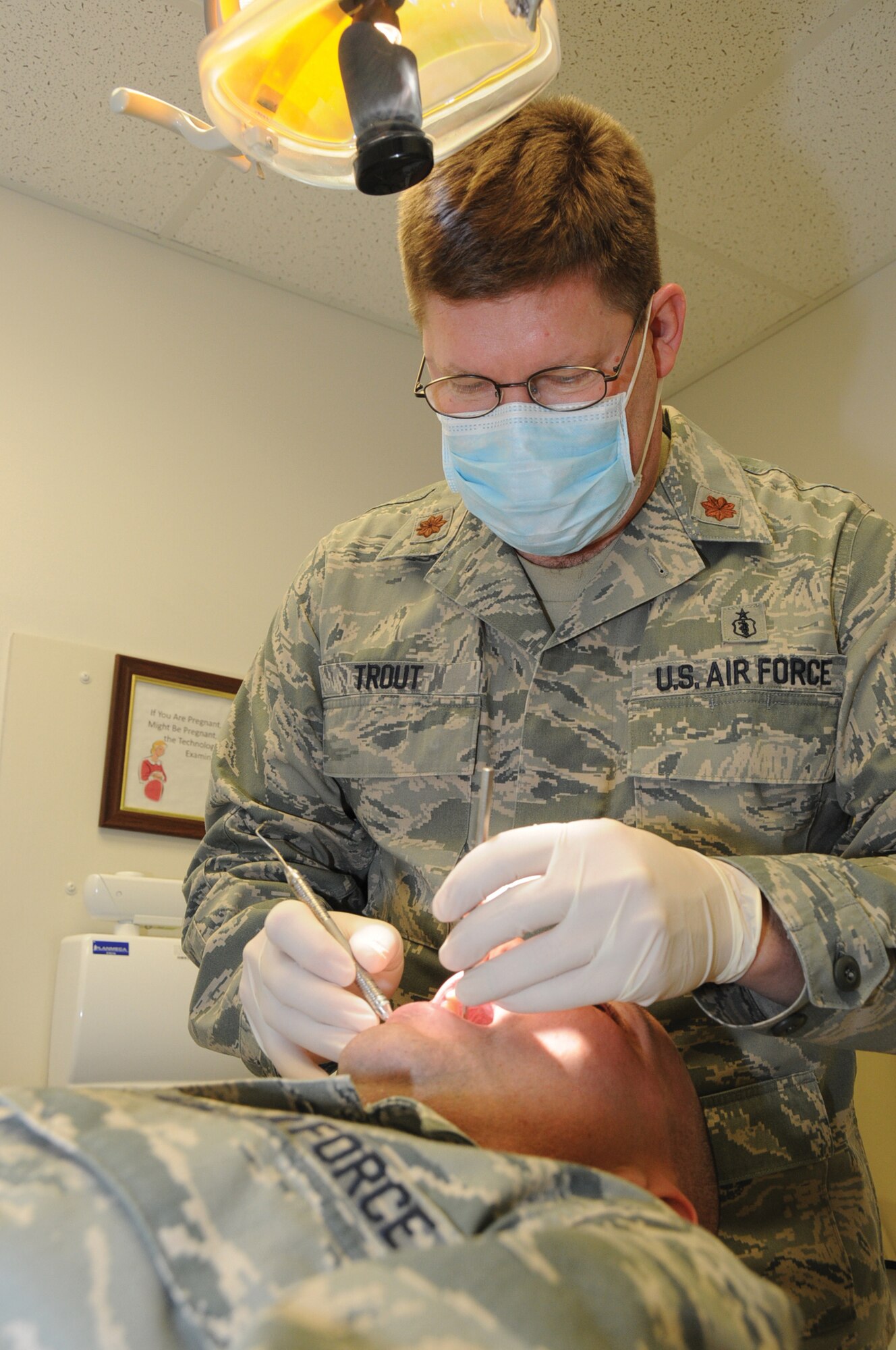 Maj. William Trout, 442nd Medical Squadron Dental Flight technician, performs a dental exam during a unit training assembly. Dental is a vital component of deployment readiness, which will be necessary for the wing’s operational readiness inspection, August 2011. The 442nd Fighter Wing is an A-10 Thunderbolt II Air Force Reserve unit at Whiteman AFB, Mo.  (U.S. Air Force photo/ Senior Airman Tracy Brown)