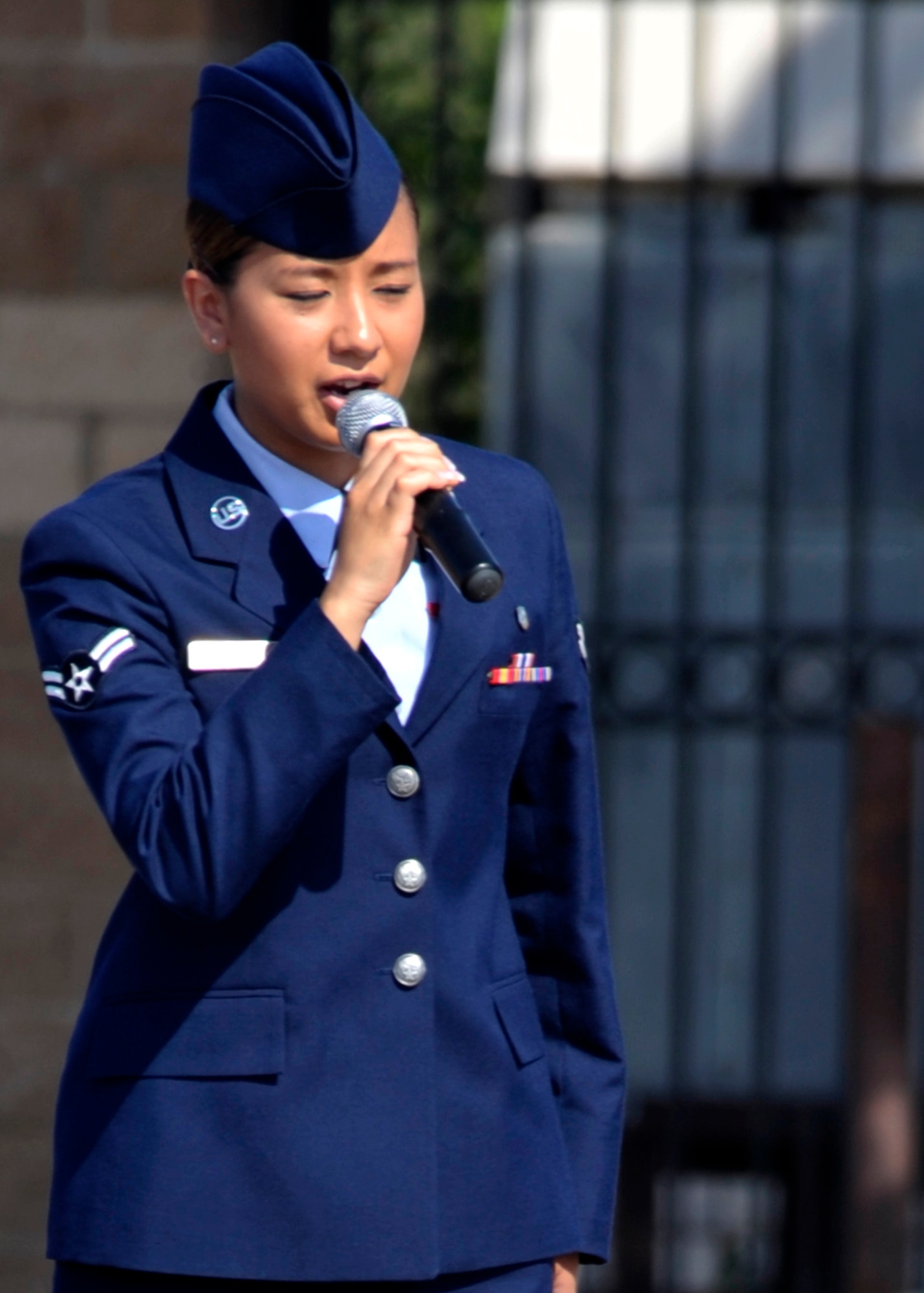 U.S. Air Force Airman 1st Class Jennifer Bodie, 27th Special Operation Medical Support Squadron, sings the national anthem at the 27th Special Operations Wing change of command ceremony at Cannon Air Force Base, N.M., July 8, 2011. Bodie won the Cannon Idol competition in 2010 and often sings at wing events. (U.S. Air Force photo by Airman Ericka Engblom)(RELEASED)
