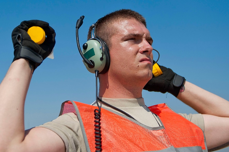Senior Airman Timothy Baker, 728th Air Mobility Squadron Maintenance Flight, marshals a C-17 Globemaster III aircraft July 11, 2011, at Incirlik Air Base, Turkey. The maintenance flight provides maintenance and supply support for Air Mobility Command military and commercial aircraft missions. (U.S. Air Force photo by Tech. Sgt. Michael B. Keller/Released)