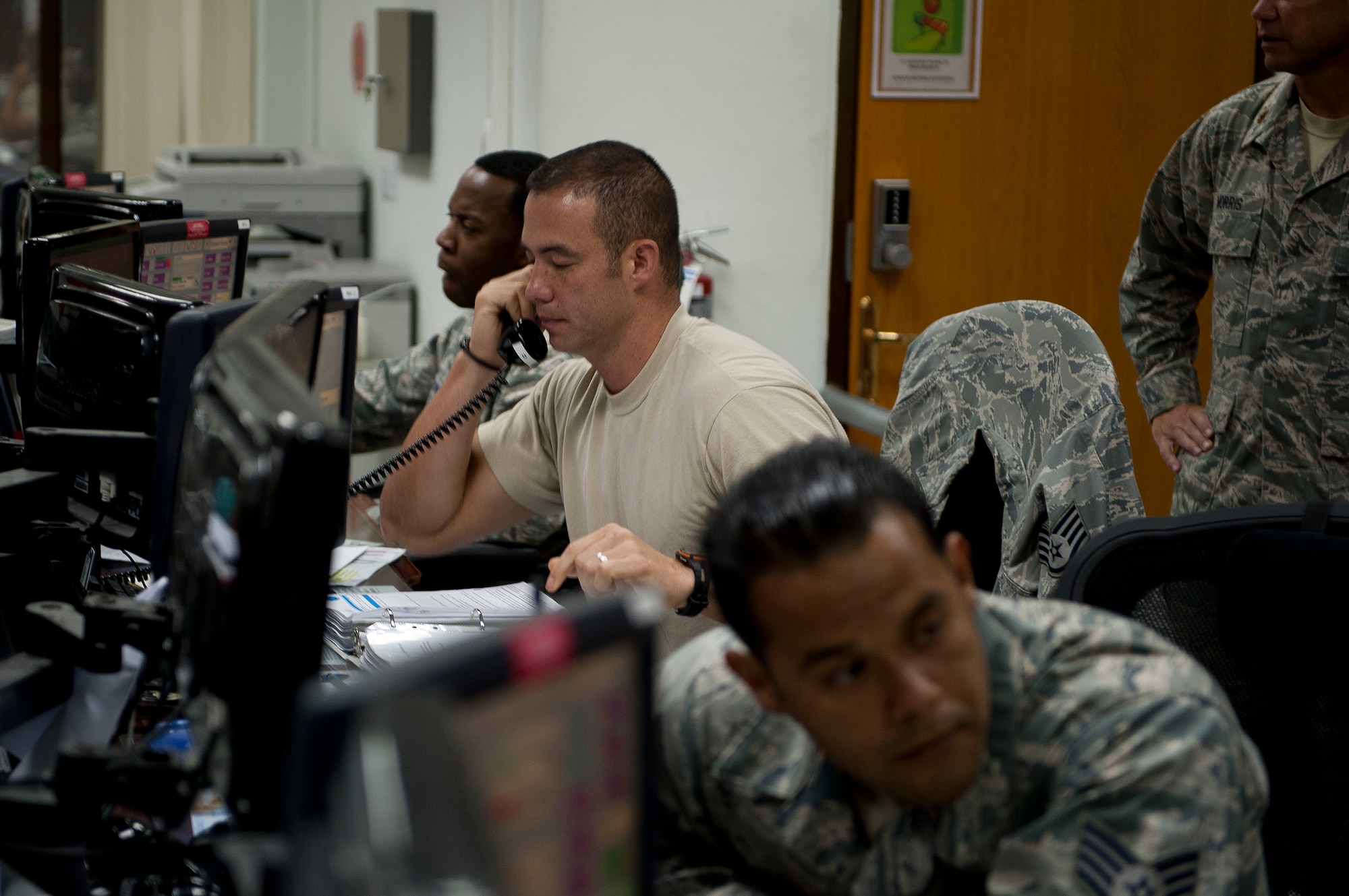 Staff Sgt. David Midyett, 728th Air Mobility Squadron, answers the phone in the air transportation operations center July 11, 2011, at Incirlik Air Base, Turkey. The center directs maintenance operations and airlift support aircraft arrivals and departures. (U.S. Air Force photo by Tech. Sgt. Michael B. Keller/Released)