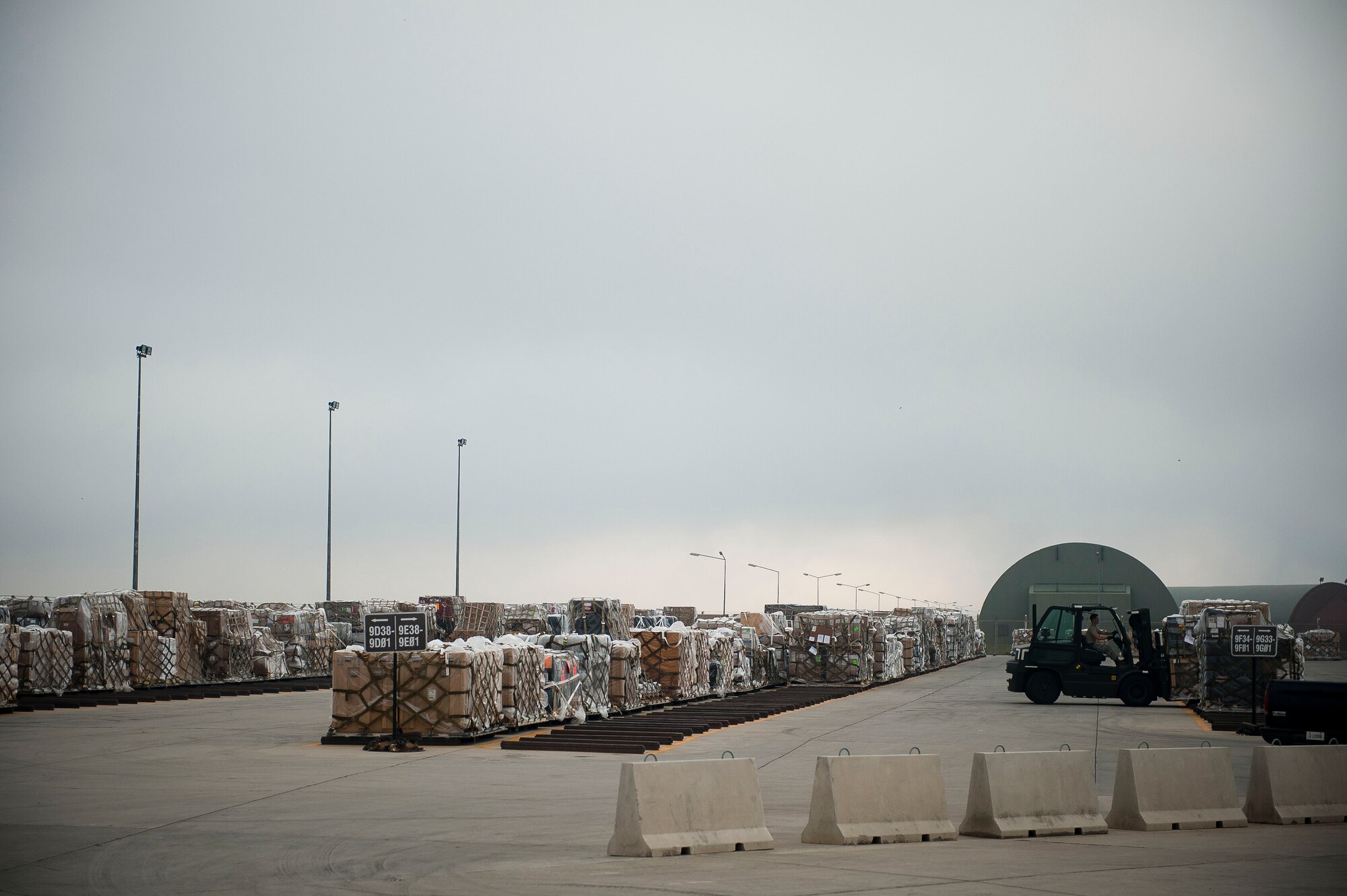 An Airman from the 728th Air Mobility Squadron Aerial Port Flight moves cargo July 11, 2011, at Incirlik Air Base, Turkey. The aerial port flight is responsible for transportation-related functions including the movement of freight bound for Europe, Africa, and Southwest and Central Asia. (U.S. Air Force photo by Tech. Sgt. Michael B. Keller/Released)