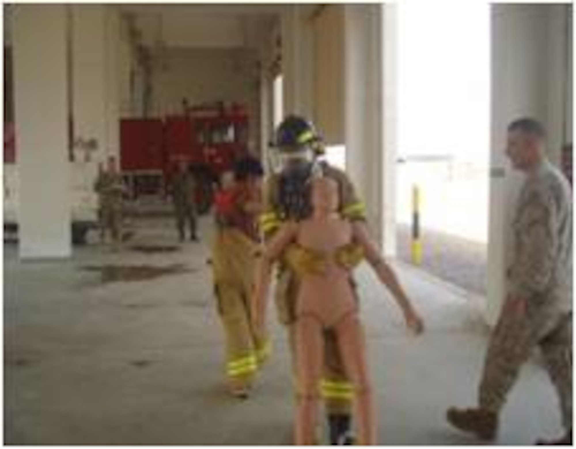 An Afghan Air Force fireman competes in the dummy drag portion of a firefighter challenge at Kandahar Air Wing July 10, 2011 in Kandahar, Afghanistan.  The event was the idea of Master Gunnery Sgt. James Babst.  When not serving in the U.S. Marines, Babst is a Philadelphia firefighter.  The competition aimed at teaching confidence and to reinforce training procedures.  AAF fireman Abdullah Jan finished first in the competition with a time of 3 minutes, 23 seconds.  (Air Force courtesy photo)    