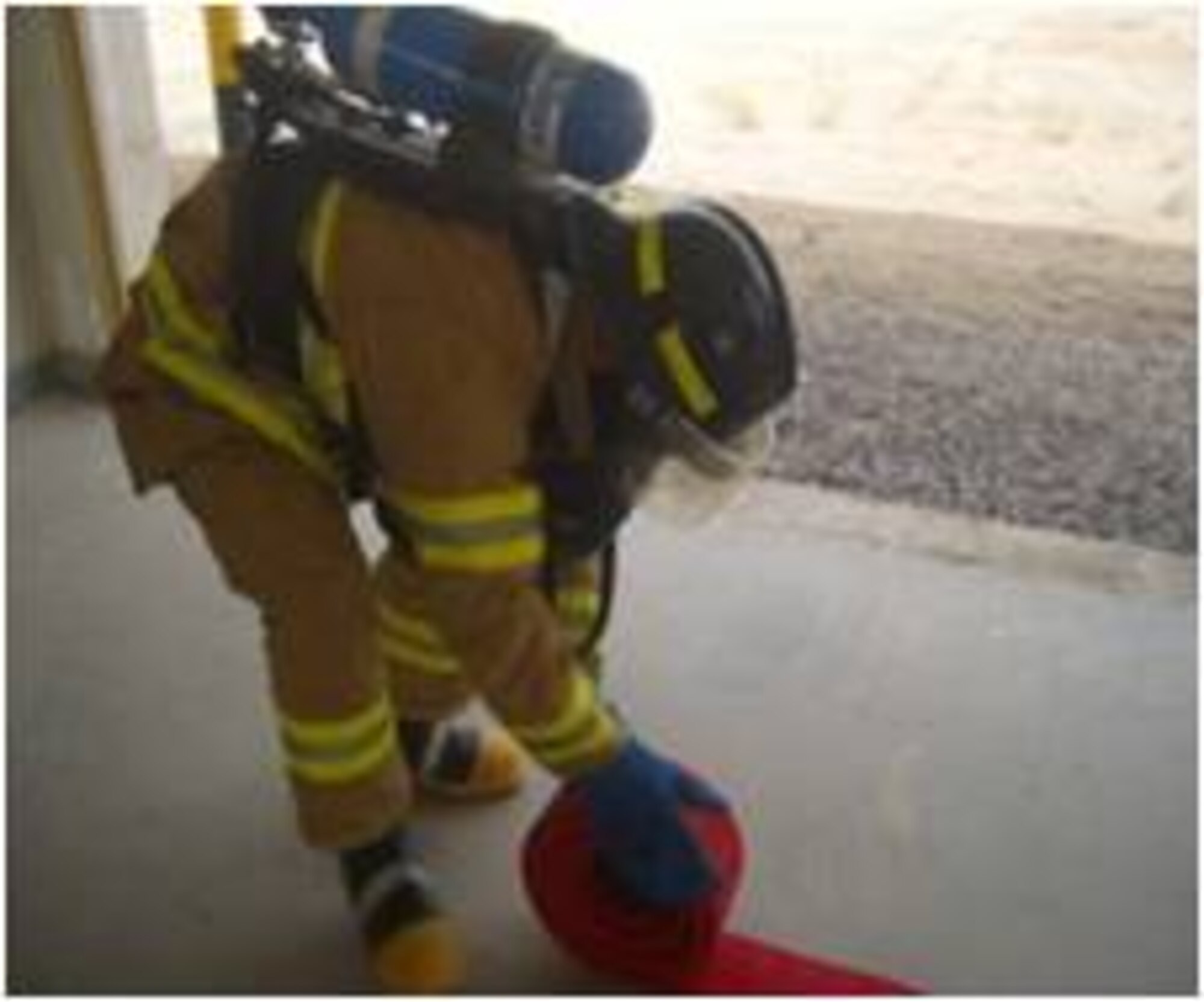 An Afghan Air Force fireman competes in the rolling hose portion of a firefighter challenge at Kandahar Air Wing July 10, 2011 in Kandahar, Afghanistan.  The event was the idea of Master Gunnery Sgt. James Babst.  When not serving in the U.S. Marines, Babst is a Philadelphia firefighter.  The competition aimed at teaching confidence and to reinforce training procedures.  AAF fireman Abdullah Jan finished first in the competition with a time of 3 minutes, 23 seconds.  (Air Force courtesy photo)    