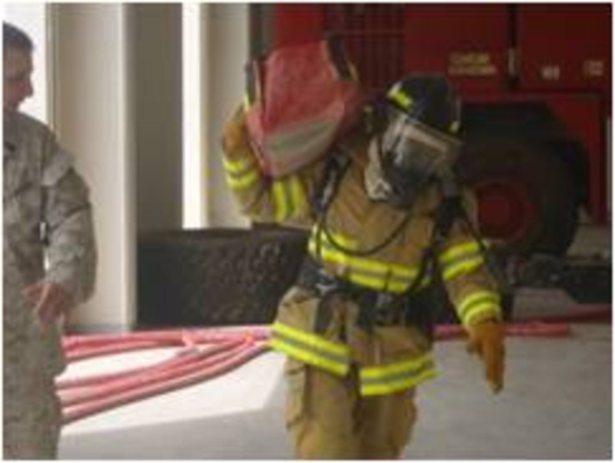 An Afghan Air Force fireman competes in a firefighter challenge at Kandahar Air Wing July 10, 2011 in Kandahar, Afghanistan.  The event was the idea of Master Gunnery Sgt. James Babst.  When not serving in the U.S. Marines, Babst is a Philadelphia firefighter.  The competition aimed at teaching confidence and to reinforce training procedures.  AAF fireman Abdullah Jan finished first in the competition with a time of 3 minutes, 23 seconds.  (Air Force courtesy photo)    